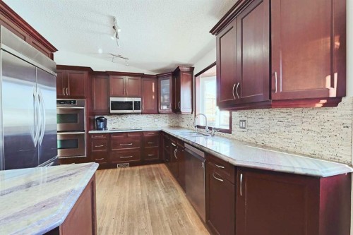 48 Bernard Way Nw, Calgary, AB - Indoor Photo Showing Kitchen With Upgraded Kitchen