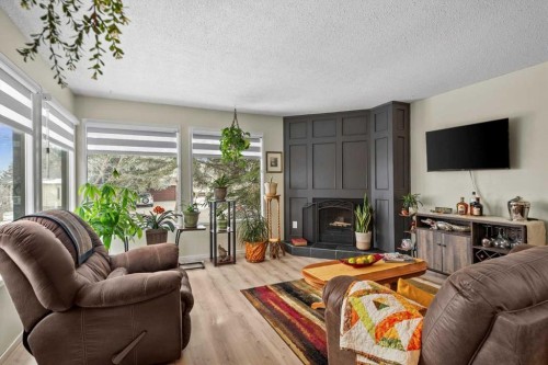 1399 Berkley Drive Nw, Calgary, AB - Indoor Photo Showing Living Room With Fireplace
