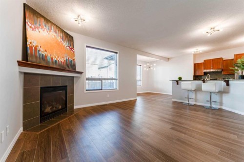 10 Everglen Crescent Sw, Calgary, AB - Indoor Photo Showing Living Room With Fireplace