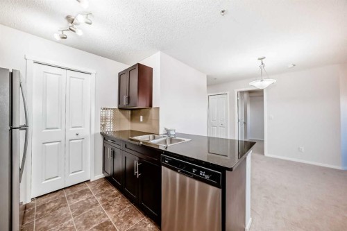2324-81 Legacy Boulevard Se, Calgary, AB - Indoor Photo Showing Kitchen With Stainless Steel Kitchen With Double Sink