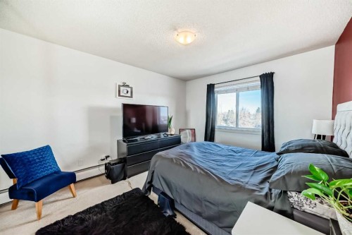 403-4455D Greenview Drive Ne, Calgary, AB - Indoor Photo Showing Bedroom