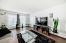 403-4455D Greenview Drive Ne, Calgary, AB  - Indoor Photo Showing Living Room 