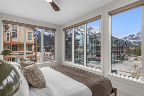 313-1408 Spring Creek Gate, Canmore, AB - Indoor Photo Showing Bedroom