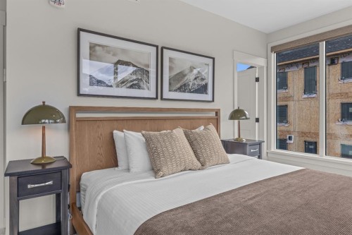 313-1408 Spring Creek Gate, Canmore, AB - Indoor Photo Showing Bedroom