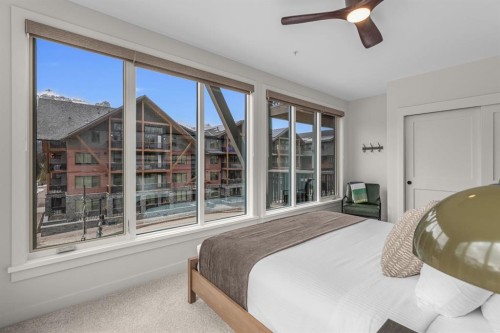 313-1408 Spring Creek Gate, Canmore, AB - Indoor Photo Showing Bedroom