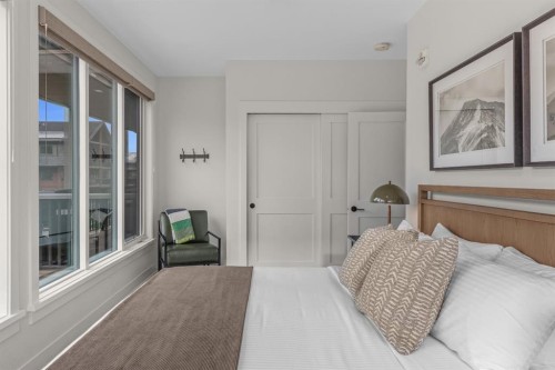 313-1408 Spring Creek Gate, Canmore, AB - Indoor Photo Showing Bedroom