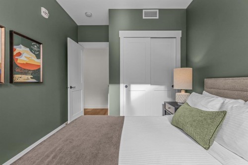 313-1408 Spring Creek Gate, Canmore, AB - Indoor Photo Showing Bedroom