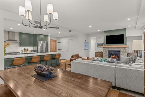 313-1408 Spring Creek Gate, Canmore, AB - Indoor With Fireplace