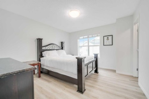 997 New Brighton Gardens Se, Calgary, AB - Indoor Photo Showing Bedroom