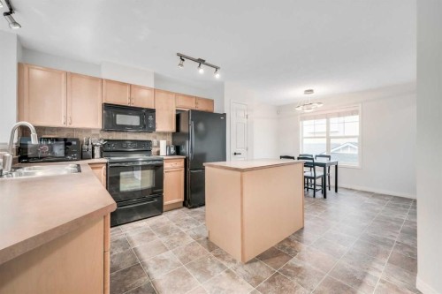 997 New Brighton Gardens Se, Calgary, AB - Indoor Photo Showing Kitchen