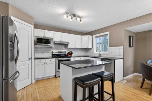 69 Elkton Way Sw, Calgary, AB - Indoor Photo Showing Kitchen With Upgraded Kitchen