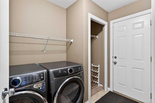 69 Elkton Way Sw, Calgary, AB - Indoor Photo Showing Laundry Room