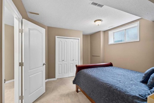 69 Elkton Way Sw, Calgary, AB - Indoor Photo Showing Bedroom