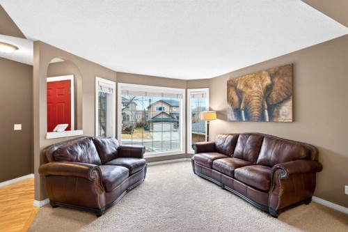 69 Elkton Way Sw, Calgary, AB - Indoor Photo Showing Living Room