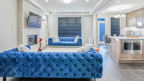 69 Carrington Way Nw, Calgary, AB - Indoor Photo Showing Living Room With Fireplace