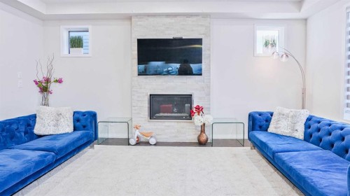 69 Carrington Way Nw, Calgary, AB - Indoor Photo Showing Living Room With Fireplace