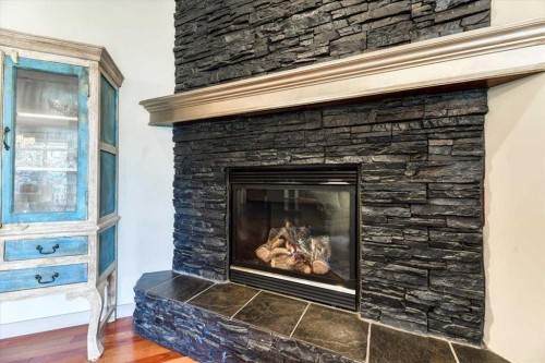 63 Discovery Ridge Circle Sw, Calgary, AB - Indoor Photo Showing Living Room With Fireplace