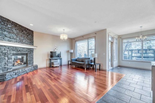 63 Discovery Ridge Circle Sw, Calgary, AB - Indoor Photo Showing Living Room With Fireplace