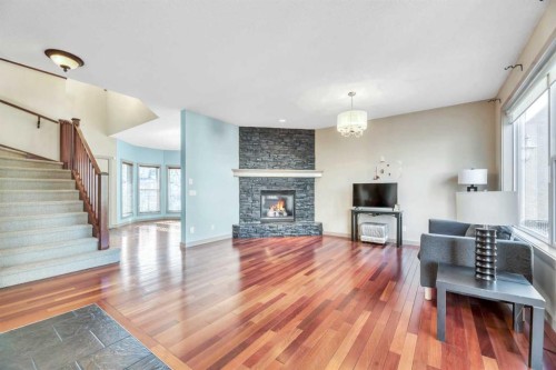 63 Discovery Ridge Circle Sw, Calgary, AB - Indoor Photo Showing Living Room With Fireplace