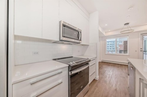 4416-6 Merganser Drive West, Chestermere, AB - Indoor Photo Showing Kitchen With Upgraded Kitchen