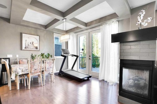 60 Cranarch Rise Se, Calgary, AB - Indoor Photo Showing Dining Room With Fireplace