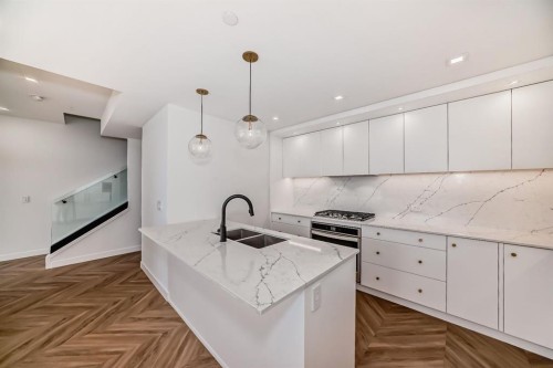 112-8445 Broadcast Avenue Sw, Calgary, AB - Indoor Photo Showing Kitchen With Upgraded Kitchen