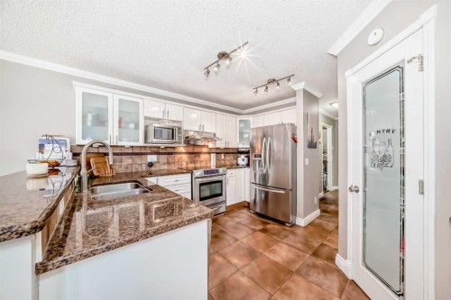 188 Hidden Ranch Crescent Nw, Calgary, AB - Indoor Photo Showing Kitchen With Double Sink With Upgraded Kitchen