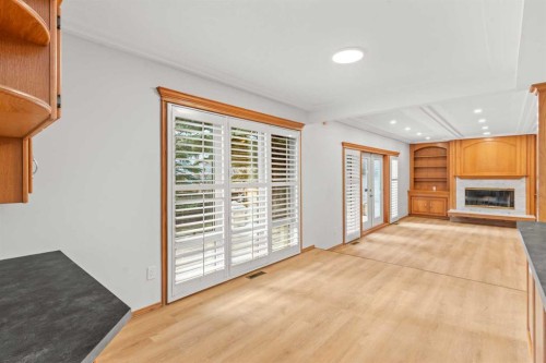 15 Patterson Drive Sw, Calgary, AB - Indoor With Fireplace