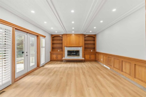 15 Patterson Drive Sw, Calgary, AB - Indoor With Fireplace