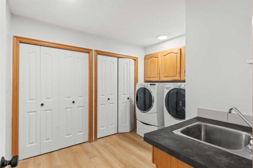 15 Patterson Drive Sw, Calgary, AB - Indoor Photo Showing Laundry Room