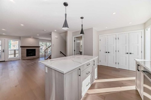 115-1330 1St Avenue, Canmore, AB - Indoor Photo Showing Kitchen With Upgraded Kitchen