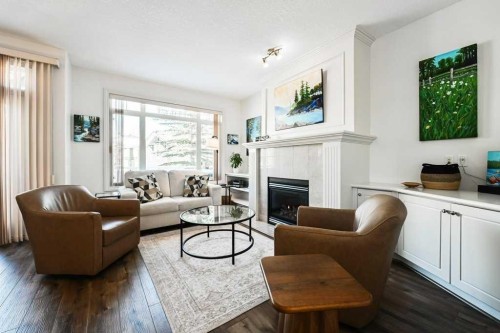 56 Discovery Woods Villas Sw, Calgary, AB - Indoor Photo Showing Living Room With Fireplace