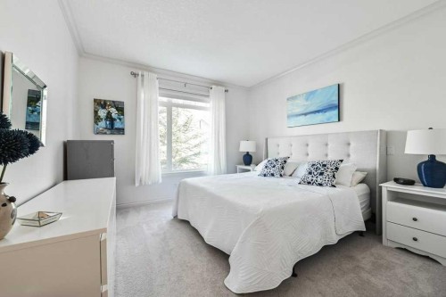 56 Discovery Woods Villas Sw, Calgary, AB - Indoor Photo Showing Bedroom