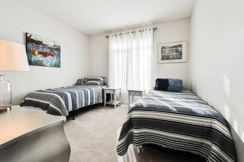 56 Discovery Woods Villas Sw, Calgary, AB - Indoor Photo Showing Bedroom