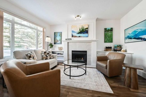 56 Discovery Woods Villas Sw, Calgary, AB - Indoor Photo Showing Living Room With Fireplace