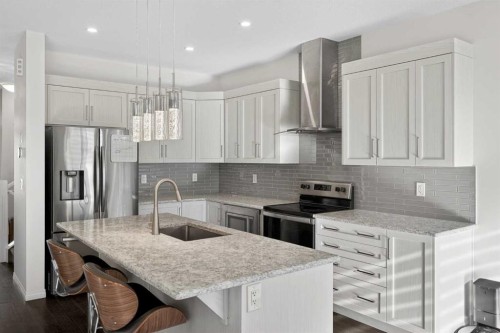 82 Osborne Common Sw, Airdrie, AB - Indoor Photo Showing Kitchen With Upgraded Kitchen