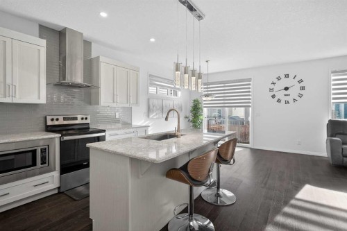 82 Osborne Common Sw, Airdrie, AB - Indoor Photo Showing Kitchen With Upgraded Kitchen