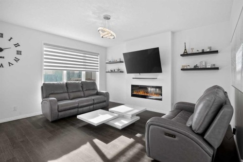 82 Osborne Common Sw, Airdrie, AB - Indoor Photo Showing Living Room With Fireplace