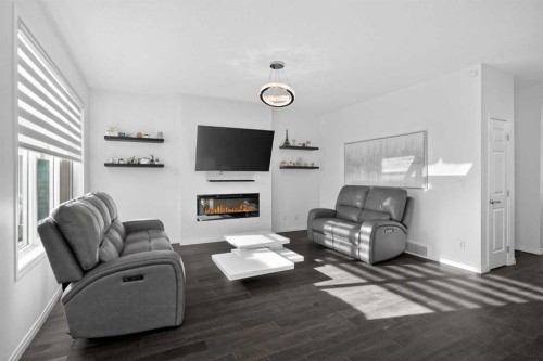 82 Osborne Common Sw, Airdrie, AB - Indoor Photo Showing Living Room With Fireplace