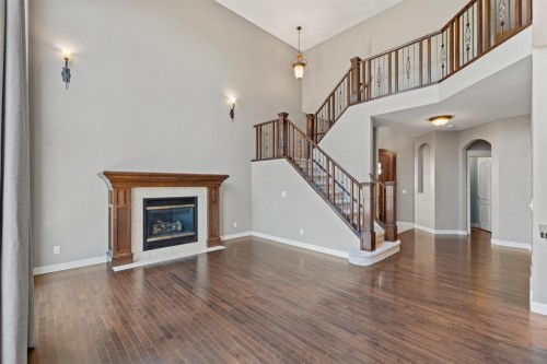 15 Cranleigh Way Se, Calgary, AB - Indoor Photo Showing Living Room With Fireplace