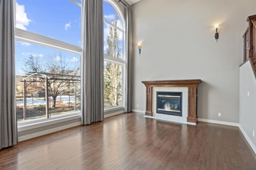 15 Cranleigh Way Se, Calgary, AB - Indoor Photo Showing Living Room With Fireplace