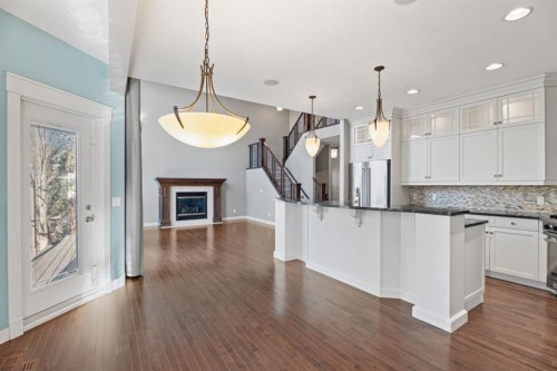 15 Cranleigh Way Se, Calgary, AB - Indoor Photo Showing Kitchen With Fireplace With Upgraded Kitchen
