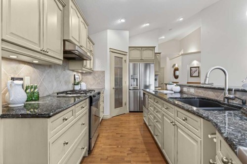 55 Billy Haynes Trail, Okotoks, AB - Indoor Photo Showing Kitchen With Stainless Steel Kitchen With Double Sink With Upgraded Kitchen