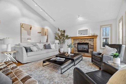 55 Billy Haynes Trail, Okotoks, AB - Indoor Photo Showing Living Room With Fireplace