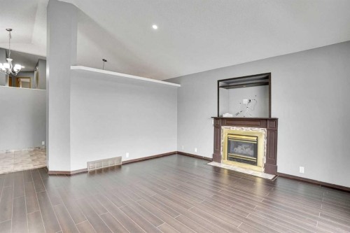 131 Martinridge Grove Ne, Calgary, AB - Indoor Photo Showing Living Room With Fireplace
