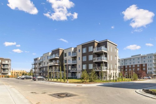 412-700 Shawnee Square Sw, Calgary, AB - Outdoor With Balcony With Facade