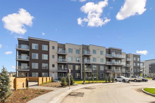 412-700 Shawnee Square Sw, Calgary, AB - Outdoor With Balcony With Facade