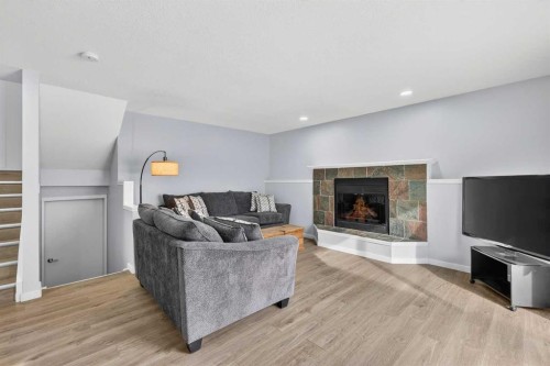 196 Deersaxon Circle Se, Calgary, AB - Indoor Photo Showing Living Room With Fireplace