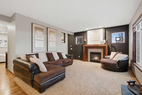 62 Chaparral Valley Grove Se, Calgary, AB - Indoor Photo Showing Living Room With Fireplace