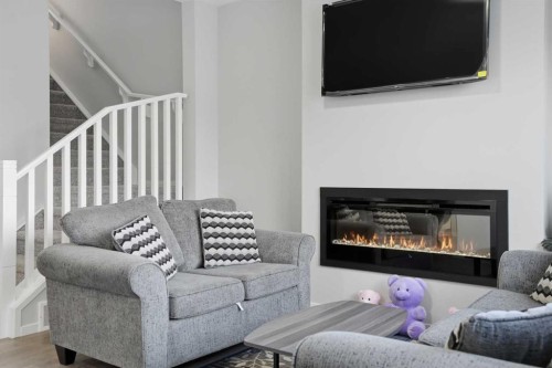 123 Cityside Crescent Ne, Calgary, AB - Indoor Photo Showing Living Room With Fireplace